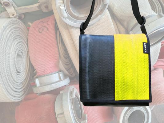 Upcycling Bags made from a used yellow fire hose and tarpaulin